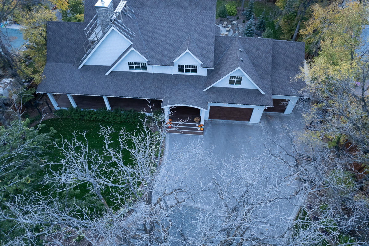 Limitless Landscaping custom landscape design in Winnipeg Manitoba, showcasing lush green lawn and modern home.