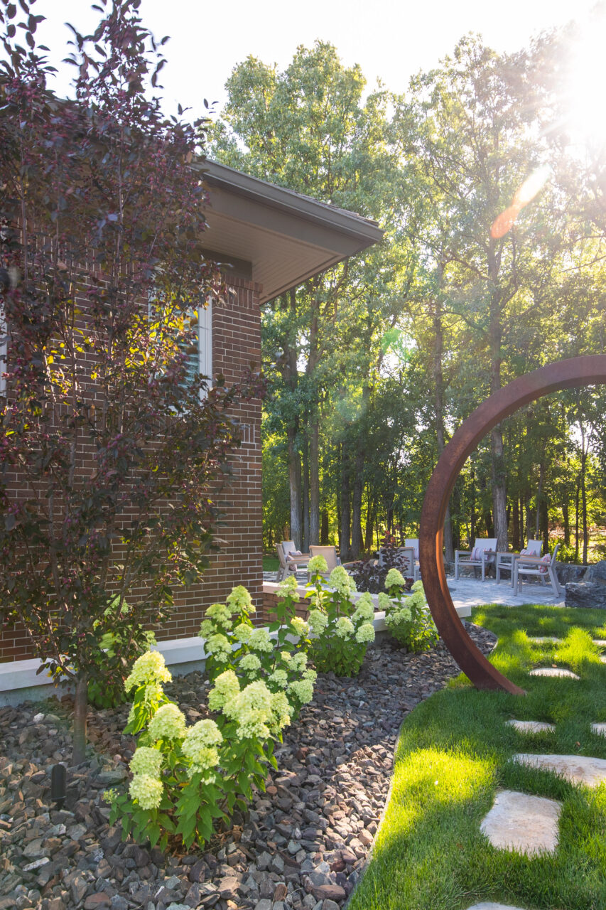 Limitless Landscaping softscaping with hydrangeas and decorative stone in Winnipeg, Manitoba landscape design project.