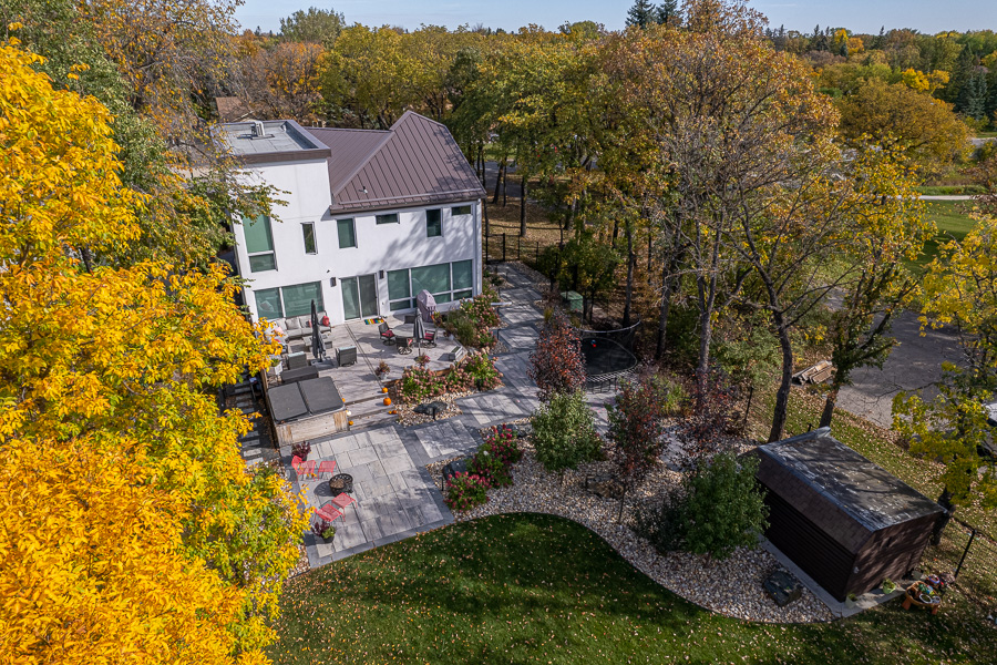 Limitless Landscaping patio design and softscaping project in Winnipeg, Manitoba, featuring seating and gardens.