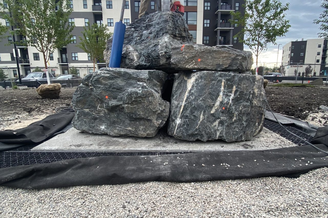 Limitless Landscaping hardscaping project with boulders on Plessis Rd, Winnipeg, Manitoba