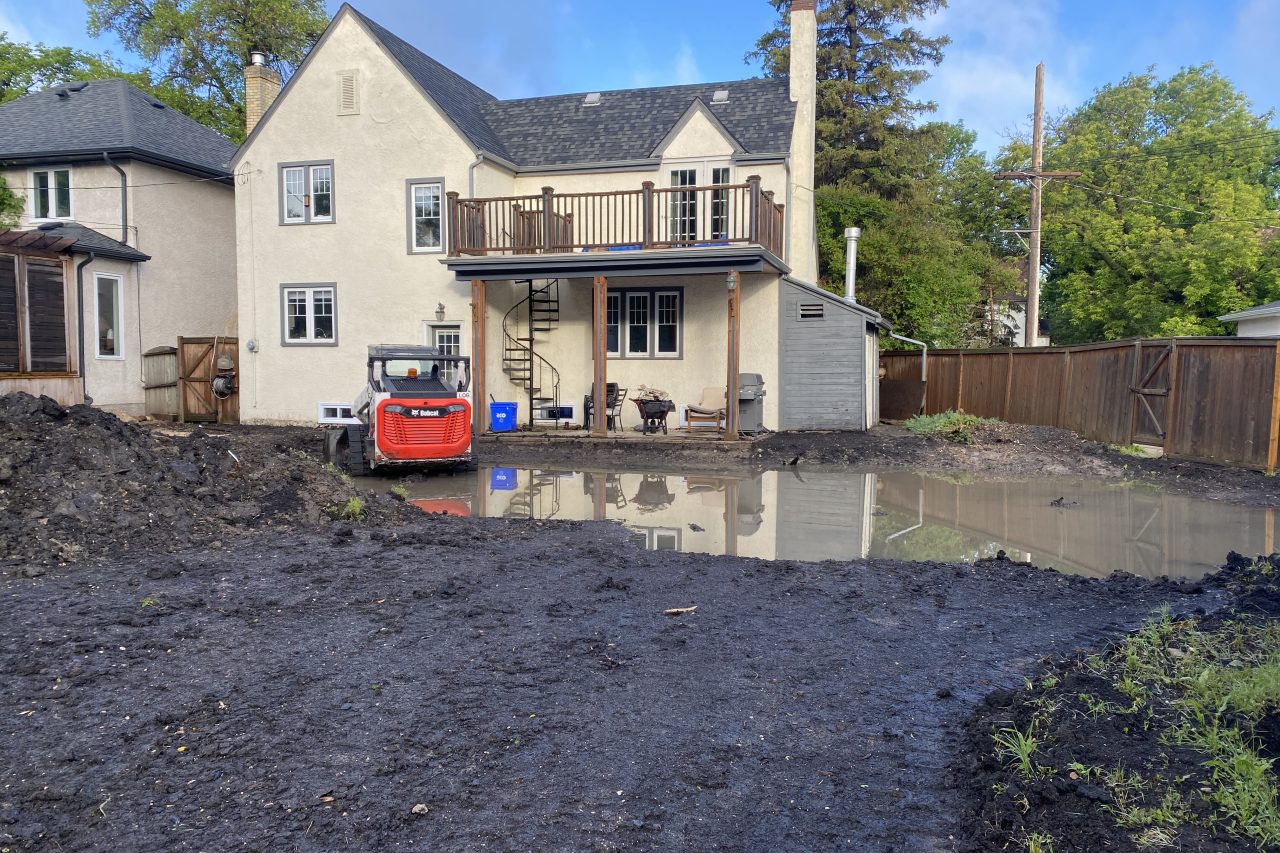 Limitless Landscaping landscape preparation site with water pooling – Winnipeg, Manitoba