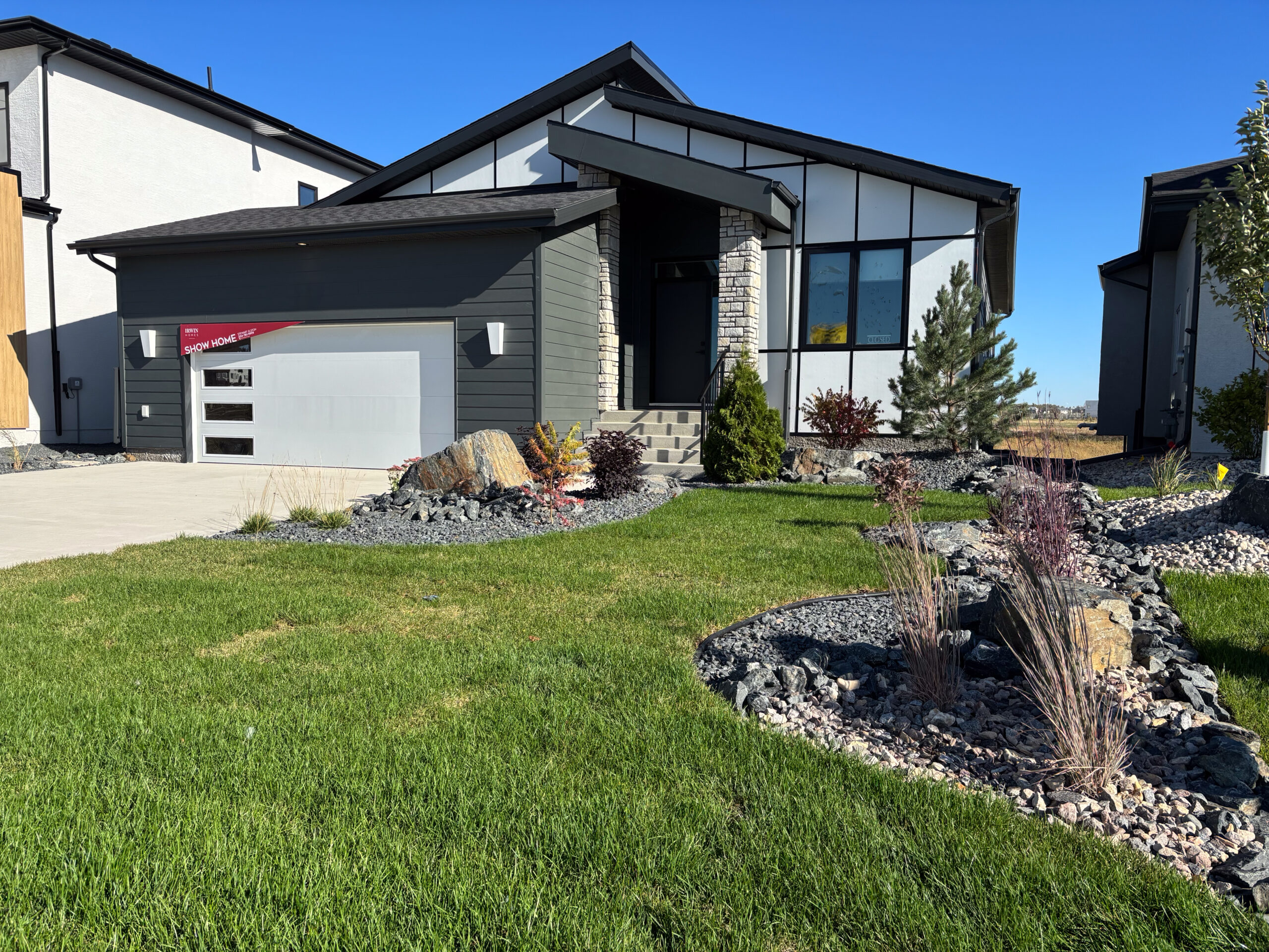 Limitless Landscaping softscaping project with decorative rocks in Winnipeg, Manitoba