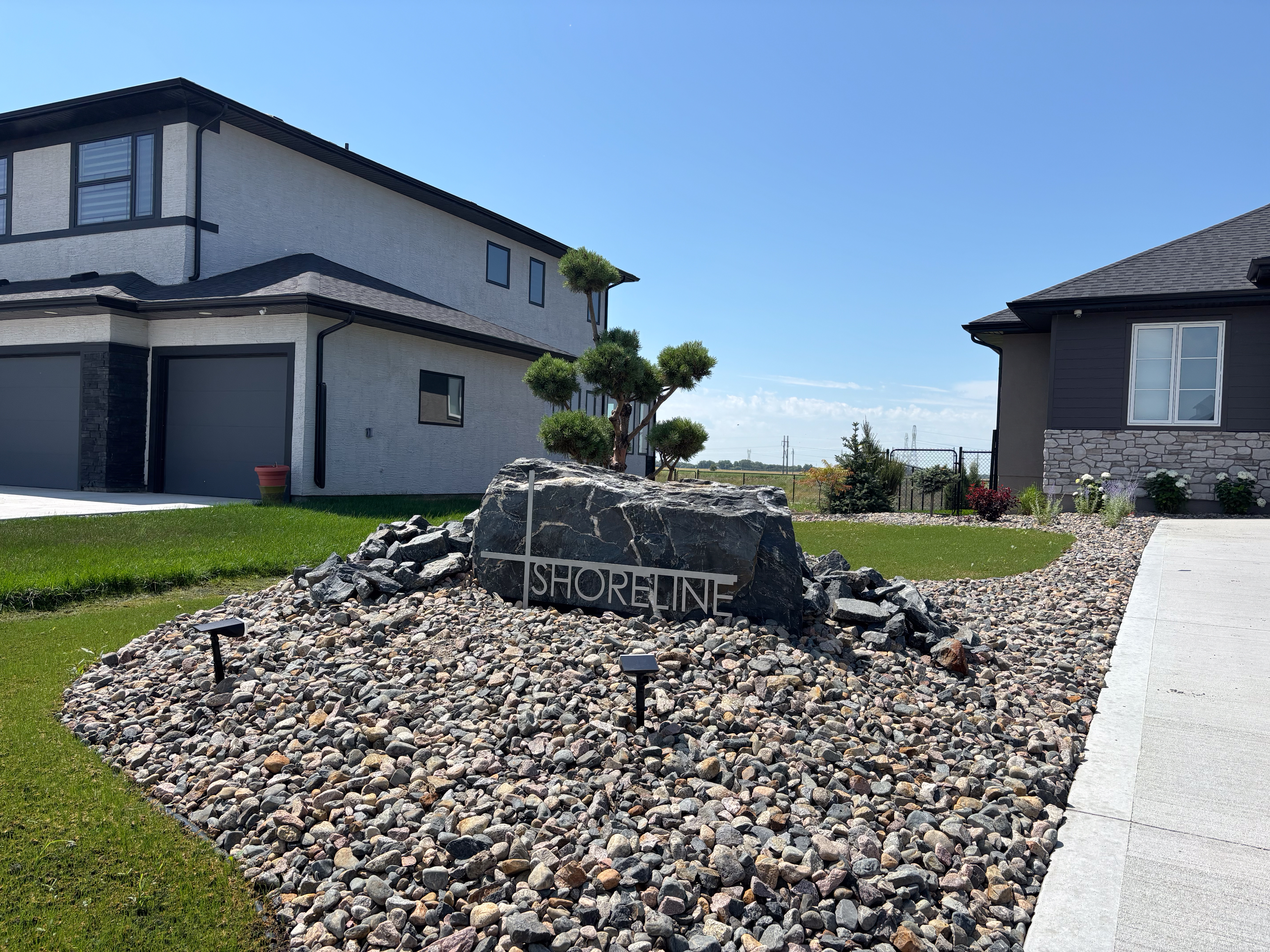 Limitless Landscaping decorative rock design at Shoreline Dr, Winnipeg, Manitoba landscape project