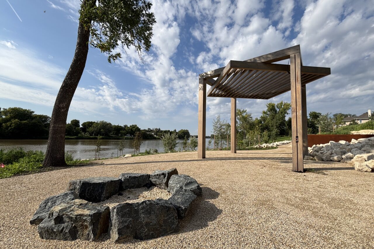 Limitless Landscaping custom hardscaping with a pergola and fire pit in Winnipeg, Manitoba