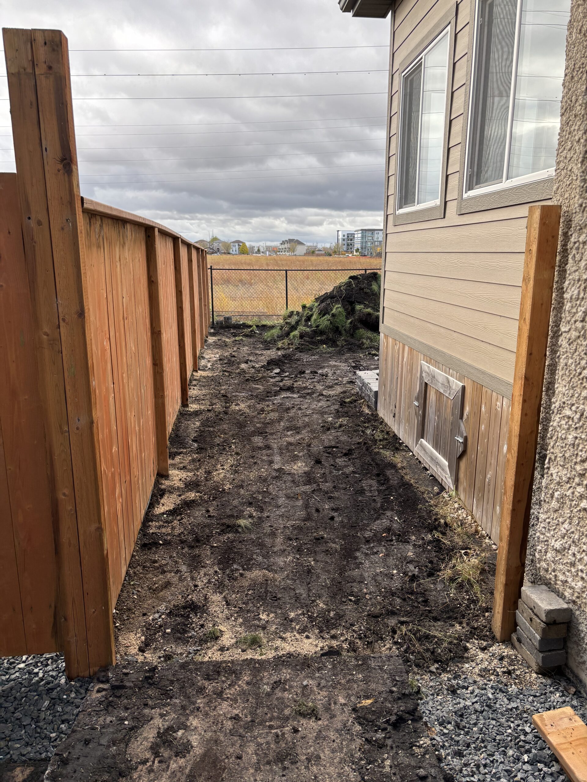 Limitless Landscaping landscape design project on Blue Sun Dr, Winnipeg, Manitoba with prepared pathway area.