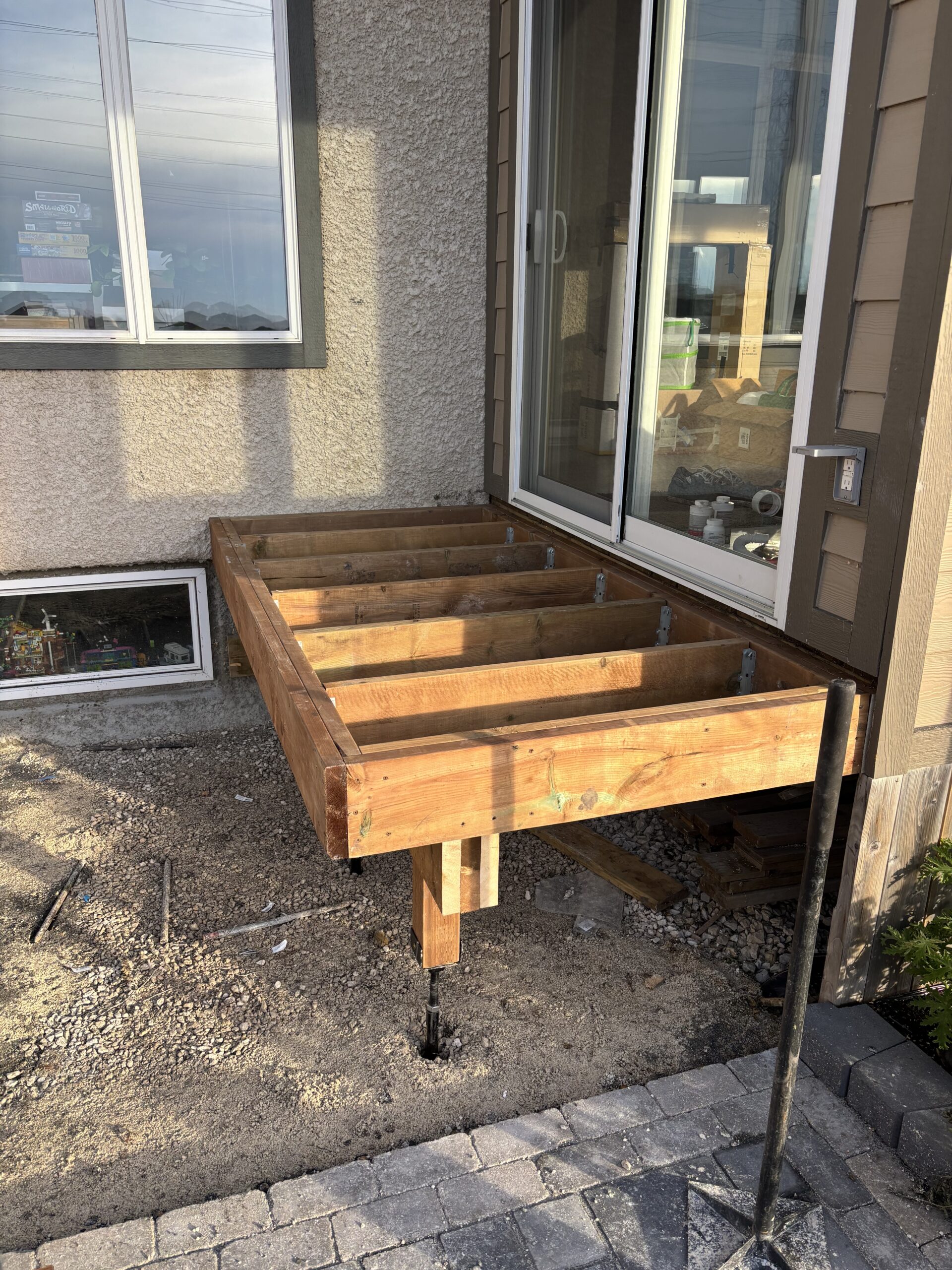 Limitless Landscaping patio construction project in Winnipeg, Manitoba with wooden frame and support beams