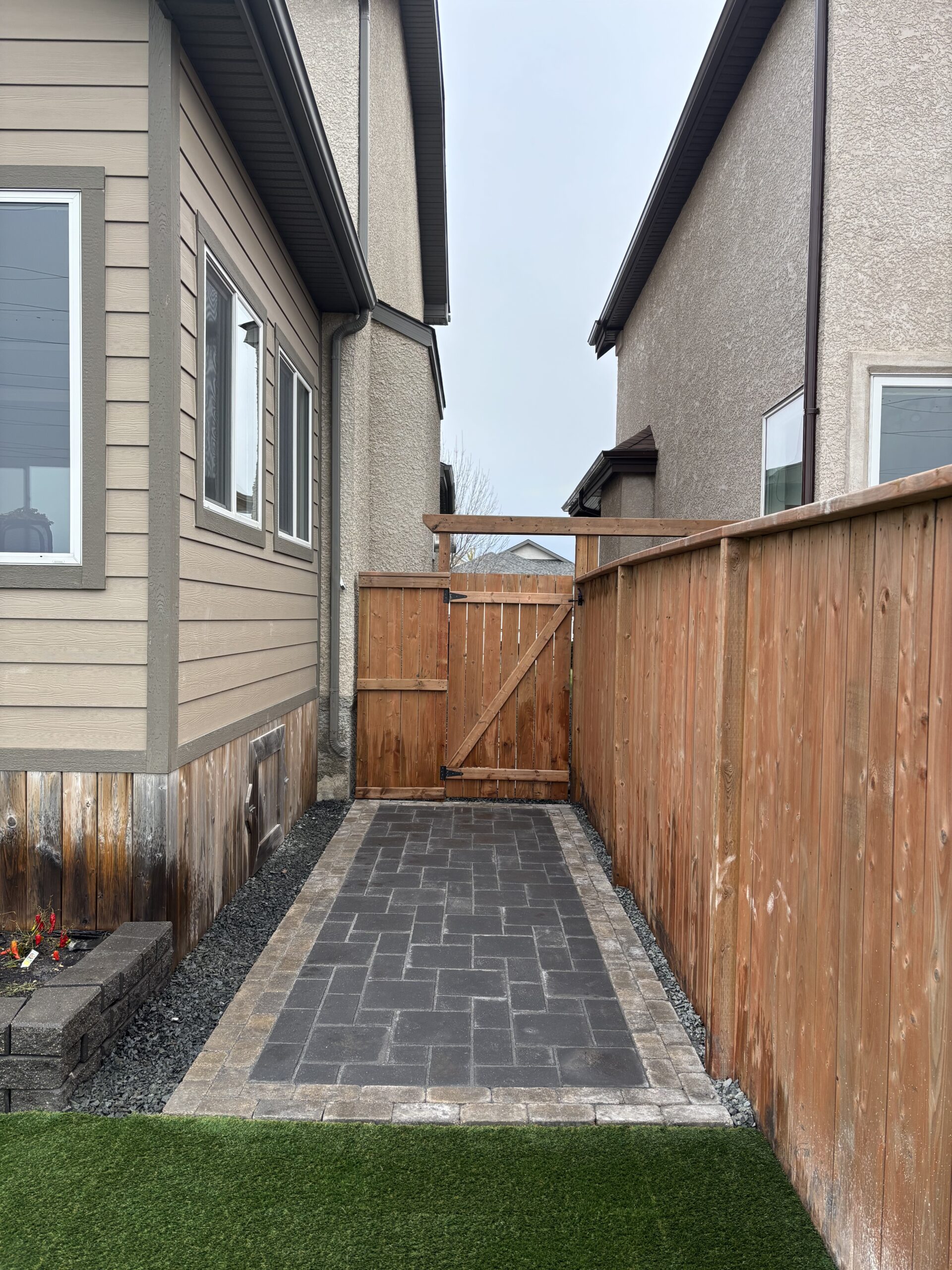Limitless Landscaping custom hardscaping project with paver walkway in Winnipeg, Manitoba.