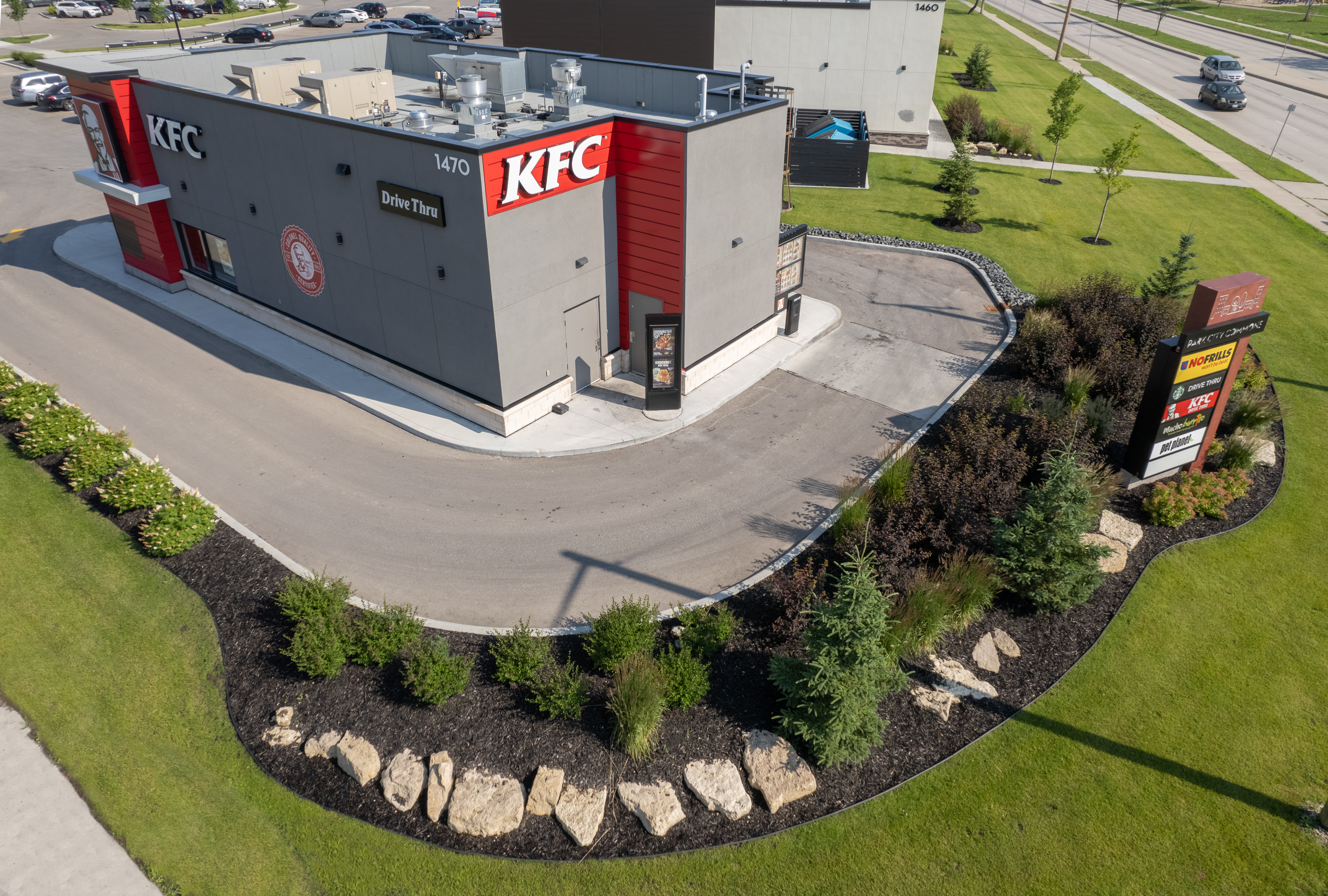 Limitless Landscaping softscaping and planting at commercial site in Winnipeg, Manitoba.